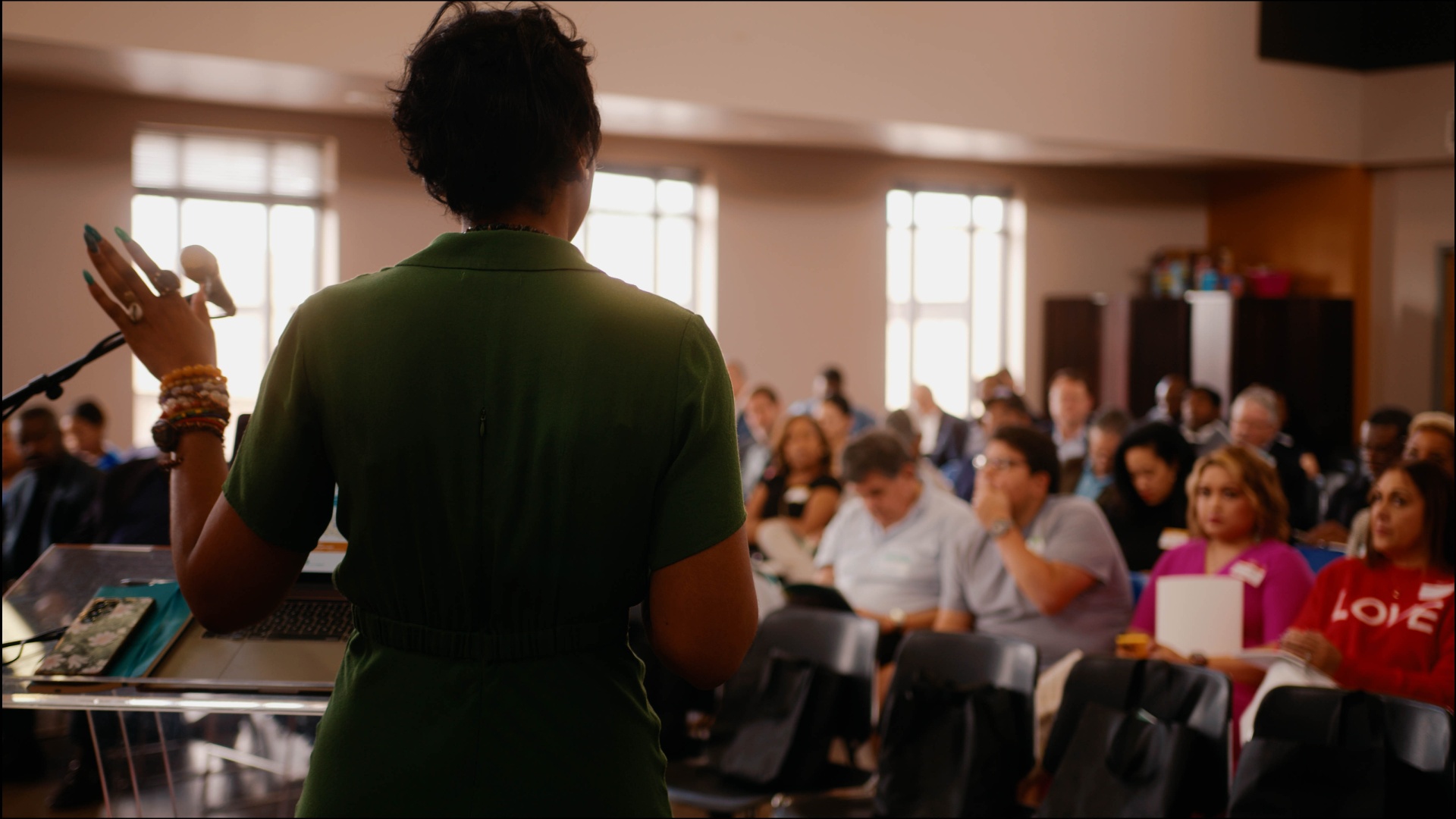 Christa speaking to a live audience